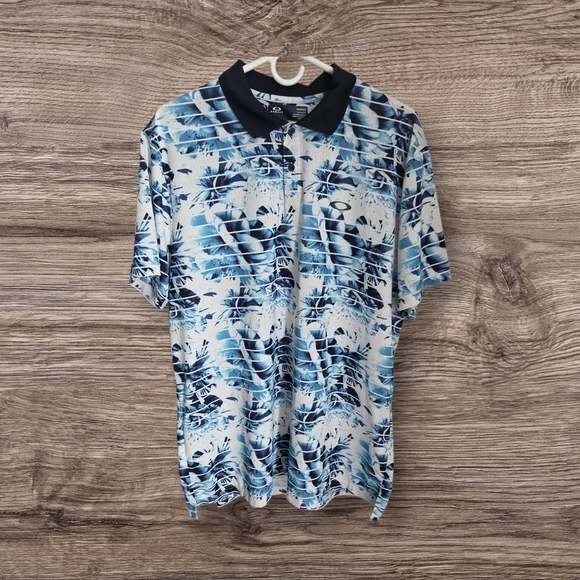 Oakley Blue and White Polo Shirt with Tropical Print - Picture 1 of 4